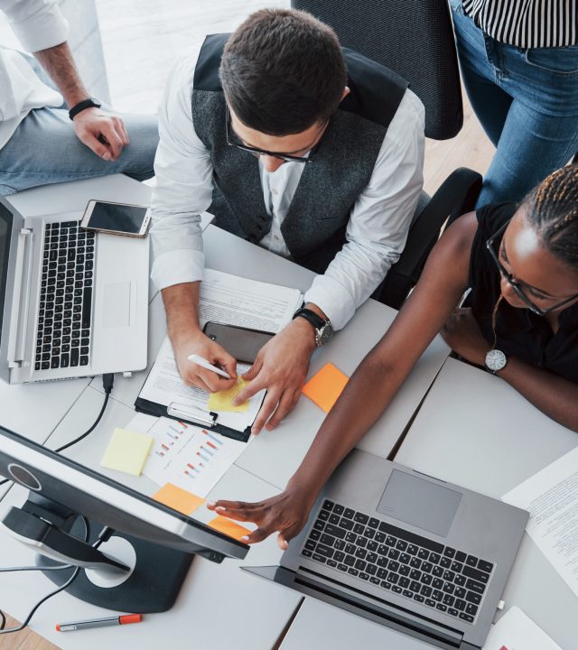 a group of multinational busy people working in the office.